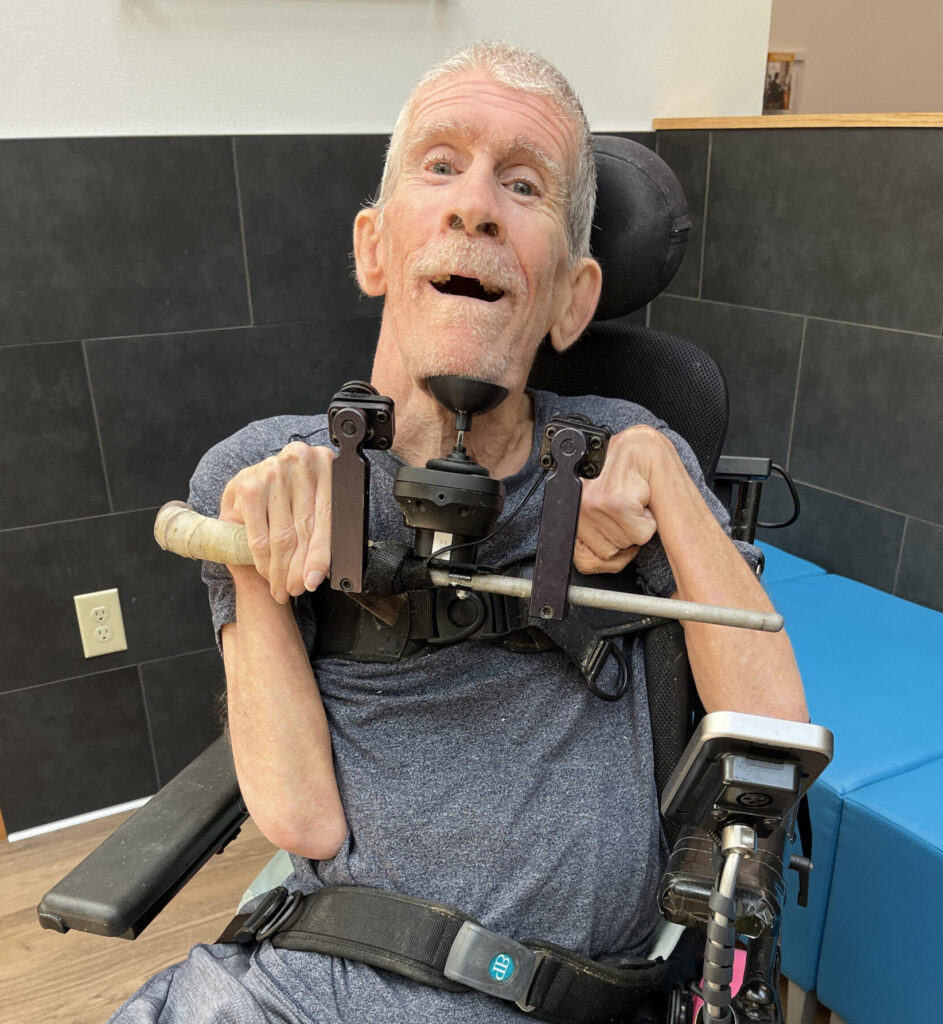 PROVAIL's client, Greg, gets a new joystick chin cup for his mobility device.